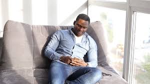 See more ideas about drawing poses, pose reference, drawing reference. Happy Black Man Sitting On Couch Stock Video Pond5