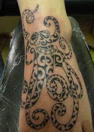 ⇓ big octopus tattoo on man's back filled with polynesian symbols. 28 Tribal Octopus Tattoos And Designs