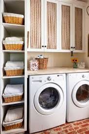 Rustic laundry room including a sliding horse shelter entryway, dark tile floors, treated steel machines, white metro tiles… continue reading →. Organized Small Laundry Room Idea Rustic Laundry Rooms Small Laundry Rooms Farmhouse Laundry Room