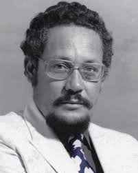 In photograph is Minister of Labor and Social Security Minister Michael  Henry and the Permanent Secretary Mrs. Colette Roberts Risden, seen here  test driving one of the Ministry's newly awarded buses.