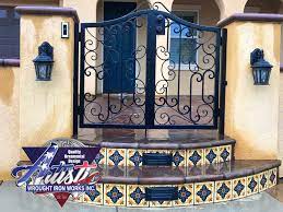 Wrought iron railings allow the view to shine through. Spanish Entry Gate Dual Artistic Artistic Wrought Iron Works Inc