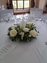 Wedding Reception Table Decoration Made Using Fresh Flowers And Foliag Wedding Reception Table Decorations Reception Table Decorations Flower Table Decorations