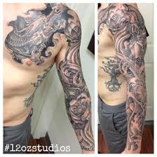 Shop tattoo inks, tattoo pens, and accessories. Amazing Black And Grey Dragon Koi Fish Japanese Themed Male Chest Arm Sleeve Tattoo By Alex Sleeve Tattoos Arm Sleeve Tattoos Black Tattoos