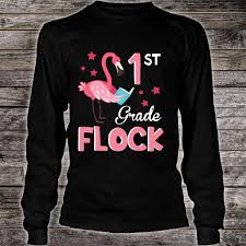 Keep them reading as much as you can! Official Flamingo Reading Book Happy 1st Grade Flock Teacher Student Shirt Hoodie Tank Top And Sweater