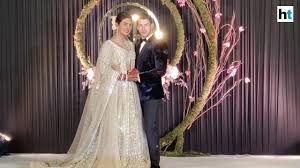 Priyanka chopra wore a red sabyasachi lehenga for her wedding. Watch Priyanka Chopra Nick Jonas Host Wedding Reception In Delhi Youtube