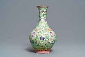 The cut out design gives the vase a unique quality while also allowing wind to pass through. A Chinese Famille Rose Lime Green Ground Vase Qianlong Mark Republic Rob Michiels Auctions
