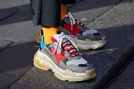 The balenciaga triple s was dominating the streets of paris during the latest women's fashion week, alongside other chunky and unconventional silhouettes. Balenciaga S Triple S Sneakers Are Making Major Bucks For The Brand Footwear News
