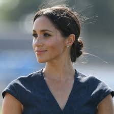 Meghan Markle Wore Flowers In Her Hair For The Sweetest Reason Meghan Markle Hair Low Bun Wedding Hair Hair Evolution