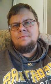 I think once you reach level 40, you should beable to have facial hair.