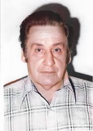 This is Thomas Vincent Russell (sitting), his wife, Ada Wood Russell  (seated) and was said to the the photographer's wife standing in the  doorway. They lived in the Lone Oak Community (east