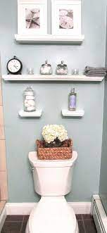 Decorations can easily become clutter in such a limited space. Decorative Floating Wall Shelves Small Bathroom Inspiration Small Bathroom Decor Bathroom Inspiration