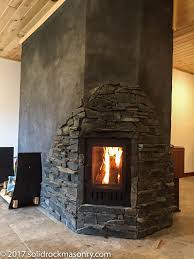 Browse 280 photos of wood stove hearth. Stacked Masonry Heaters Finished In Slate And Stucco Solid Rock Masonry