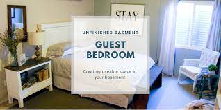 The metal cabinet beside the bed was a thrift store find as well as the tufted. Unfinished Basement Guest Bedroom Emily S Project List