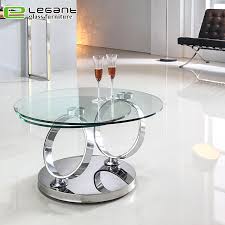 The coffee table is oval shaped while the end table is round. Rotatable Tempered Glass Coffee Table With Stainless Steel Base China Coffee Tables Tables Made In China Com
