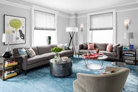 Luxurious living room awash in multiple exotic textures, featuring marble topped bar table, leather easy chairs, overstuffed orange sofa and large tufted bench ottoman next to hardwood coffee table. How To Get The Perfect Furniture Arrangement Decor Aid