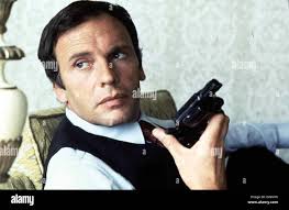 Brutale Schatten Un Homme Est Mort Jean-Louis Trintignant Der franzoesiche  Auftrags-Killer Lucien (Jean-Louis Trintignant Stock Photo