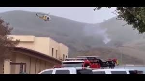 People watch as smoke rises from the scene of a helicopter crash that killed basketball star kobe bryant in calabasas, california, on sunday, jan. Real Video Of Kobe Bryant Helicopter Crash Site Youtube
