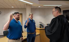 Judge DeLeone swearing in John Jusko as a Juvenile Corrections Officer.