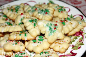 In a very large mixing bowl, combine the eggs and sugars. Paula Deen Spritz Cookies