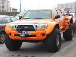 bright orange modified toyota tacoma featured in topgear usa toyota toyota hilux bucket truck