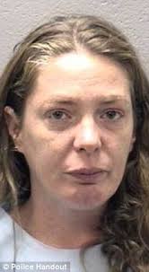 Charged: Nora Peterson, 34, has been charged with murder after allegedly hitting her boyfriend Michael Mielczarek over the head with several different ... - article-2191462-14A30C00000005DC-277_233x423