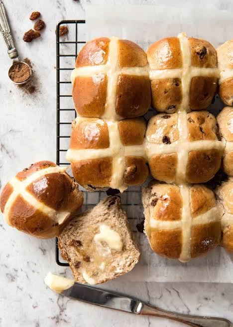 Freshly baked hot cross buns enjoyed at Easter.