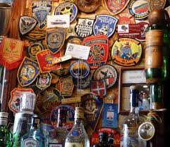 Badges On The Wall Of Harry S New York Bar How Do They Get There Patrons Bring Extra Badges Rip Them Off Their Shirts Paris New York Bar Harrys Paris