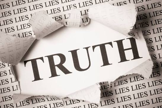 ripped paper with truth peeking out 