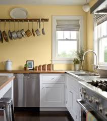 White Kitchen Cabinets And Pale Yellow Walls Country Style Kitchen Yellow Kitchen Walls Kitchen Wall Colors