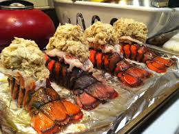 Bringing the edges of the foil over the tails to cover. Crab Stuffed Lobster Tails Spill The Beans