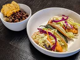 Remove 1/3 of the sauce and toss the fish pieces to coat. Oc Homemade Baja Fish Tacos On Whole Wheat Tortillas With Guacamole And Spicy Yuzu Cabbage Salad A Side Of Cauliflower Rice And Cuban Black Beans Soy Flaxseed Tortilla Chips And A
