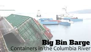 Columbia river bar pilots risk their lives every day and night to keep cargo ships moving across the a barge with a happy face is pushed by a tug boat through the scenic columbia river gorge. Shipping Containers In The Columbia River The Big Bin Barge Trg Peak Blog