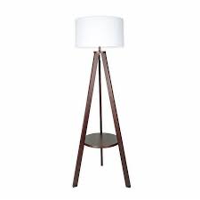 W Home Shaffer Wood Shelf Floor Lamp Bed Bath Beyond A contemporary torchiere floor lamp with three handy shelves built in its frame to allow for display and additional storage.