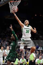ThunderRidge Justin Mccaw gies up for a shot past George Washington... News  Photo
