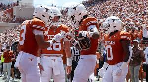 College football players competing during a Week 1 game