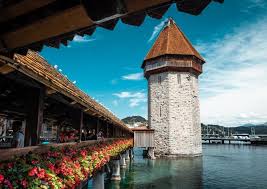 CHAPEL BRIDGE & WATER TOWER are must-see attractions in LUCERNE—want to discover more of the city's top attractions? Check out our guide (link in the comments).