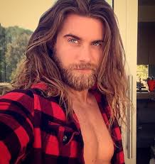 Handsome young man with long hair naked torso on black background smiling, lifestyle people concept. Pin On Oh My