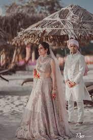 Breathtaking Beach Wedding With The Bride In Stunning Pastel Outfits Bride Bridal Outfits Bride Groom Photos