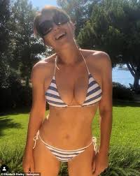 Damian hurley is unrecognisable in new photo. Elizabeth Hurley Shows Off Phenomenal Figure In A Perilously Skimpy Blue And White Striped Two Piece Daily Mail Online