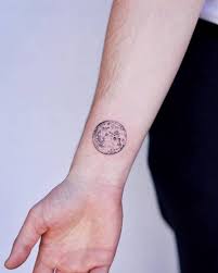 This moon looks like what you might see in the night sky. Full Moon Wrist Tattoo Full Moon Tattoo Designs