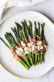 Prosciutto Wrapped Asparagus With Parmesan Cheese And Almonds Prosciutto Wrapped Asparagus Asparagus Recipe Gluten Free Holiday Recipes