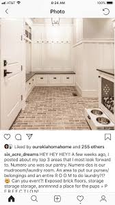 In this open floor plan contemporary home, a brick accent wall helps define the kitchen and living room spaces in the open plan. Brick Floor Dreamkitchenbricktinykitchen Brick Flooring Laundry Room Flooring Brick Bathroom