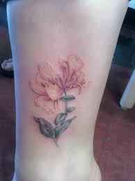 More than 60.000 free tattoos. Latest Honeysuckle Tattoos Find Honeysuckle Tattoos