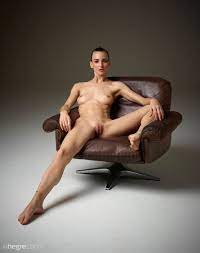 Flora Nude in a Leather Chair