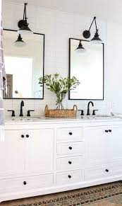 Hardware is like jewelry in a bathroom. Modern Farmhouse Master Bathroom White And Black Bathroom Dark Hardware Master Bathroom Renovation Modern Farmhouse Master Bathroom Bathroom Vanity Decor