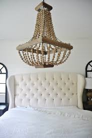 An expansive master bedroom by colorful concepts interior design features a showstopping ceiling fixture. Master Bedroom Makeover Chandelier Liz Marie Blog