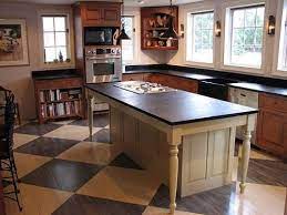 Some islands have a raised bar seating area that is 42″ high, or a lower table height counter area that is 30″ high. Kitchen Islands With Legs Hybrids Of Farm Tables And Cabinets Decoracion De Unas Cocinas