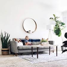 Living room with couch, modern side table and gray window curtains. Home Decor Ideas Official Youtube Channel S Pinterest Acount Slide Home Video Home Design Living Room White Minimalist Living Room Living Room Scandinavian