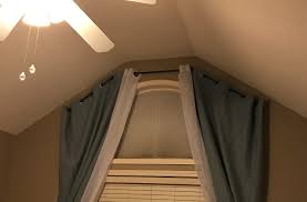 Next i hung the brackets and put the conduit in place, then i stuffed some plastic tubing in the joints to connect the rods. Bay Window Curtain Rod For Half Circle Window Frugal Thumb