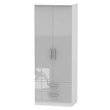 The tall and thin free standing cabinet has a simple frame base and a top that flares out from the cabinet. Fourisse Tall 2 Door Wardrobe With Drawers White Robert Dyas